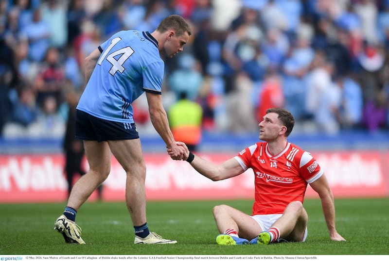 12 May 2024; Sam Mulroy of Louth and Con O'Callaghan  of Dublin shake hands after the Leinster GAA Football Senior Championship final match between Dublin and Louth at Croke Park in Dublin. Photo by Shauna Clinton/Sportsfile