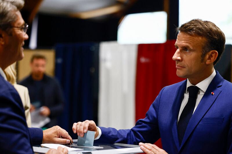 President Emmanuel Macron casts his ballot in Le Touquet-Paris-Plage in northern France (Yara Nardi/Pool/AP)