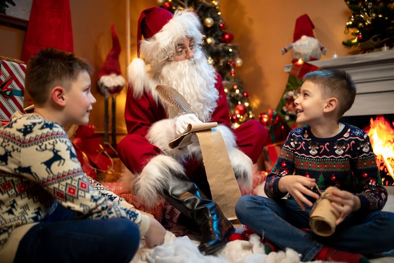 Boy looking at Santa Claus