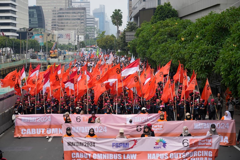 Workers march during a May Day rally in Jakarta, Indonesia, urging the government to raise minimum wages and improve working conditions (Achmad Ibrahim/AP)