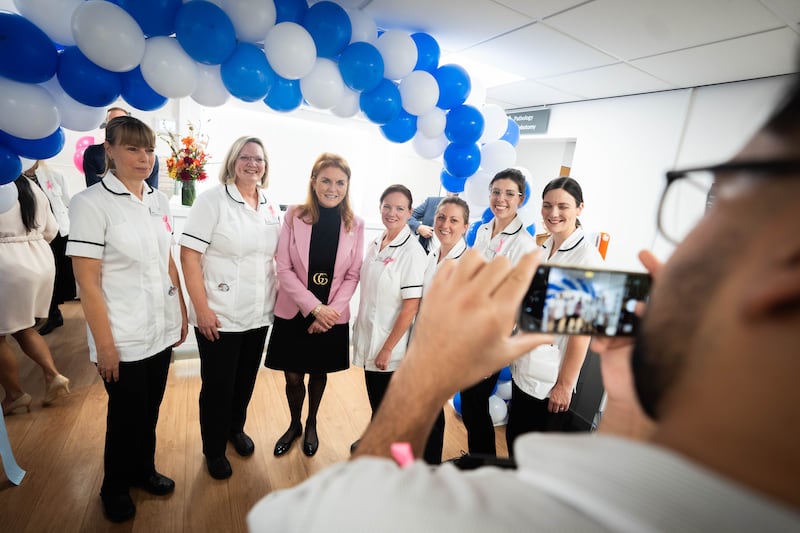 Sarah, Duchess of York, poses with staff during a visit to The Chiltern Hospital