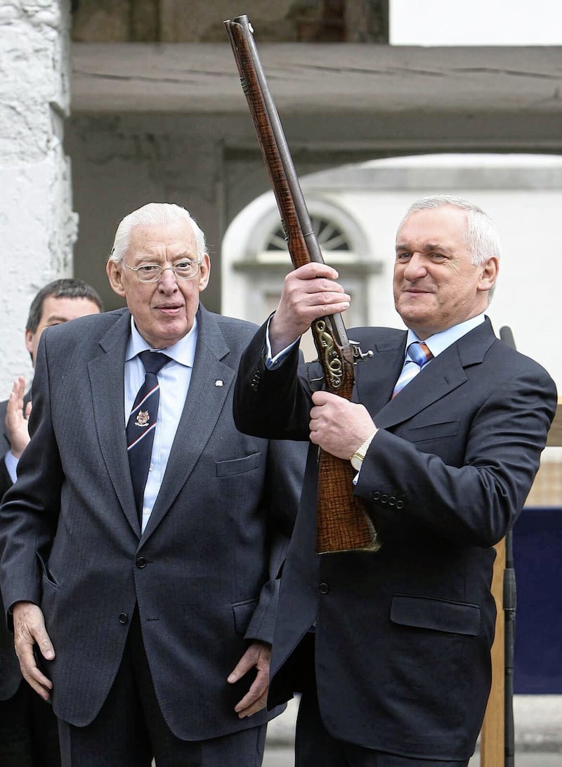 Then Taoiseach Bertie Ahern hands then Northern Ireland First Minister Ian Paisley a 300-year-old musket during their visit to the historic Battle of the Boyne site in Co Meath in 2007. Both men returned the following year to open a visitor centre. Picture by Niall Carson/PA Wire