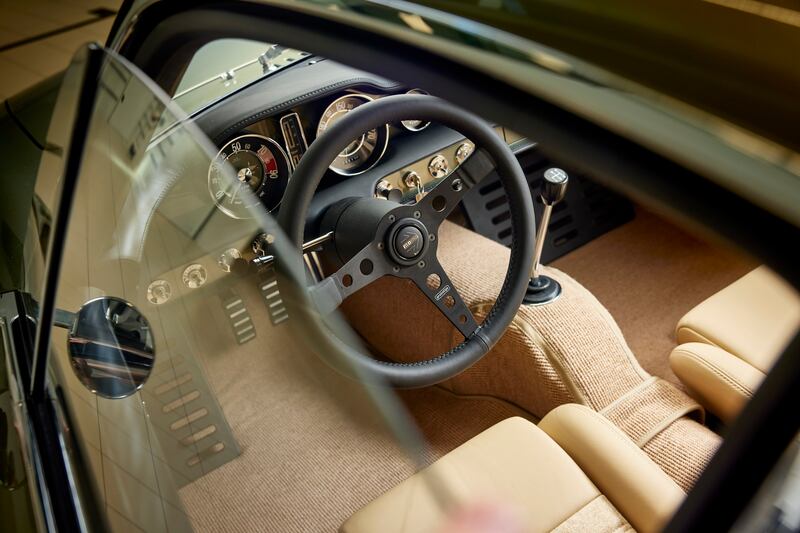 The sand-coloured leather and fabric of this metallic green P1800 is a particularly fetching combination.