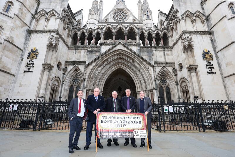 Some of the Treloar’s boys with lawyer Des Collins outside the High Court in London (Collins Solicitors/handout)