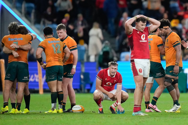 Wales players react following their defeat by Australia (Rick Rycroft/AP)