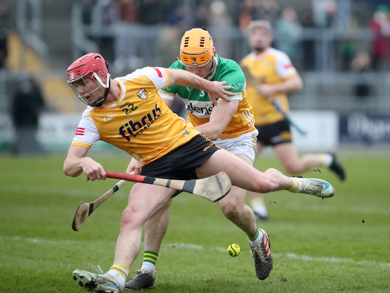 Antrim's Eoghan O'Neill in action against Offaly's Ciaran Burke.