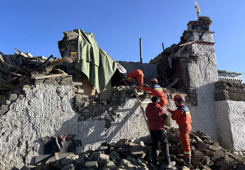 Rescue workers search for survivors in the aftermath of an earthquake in Changsuo Township of Dingri in Xigaze (AP)