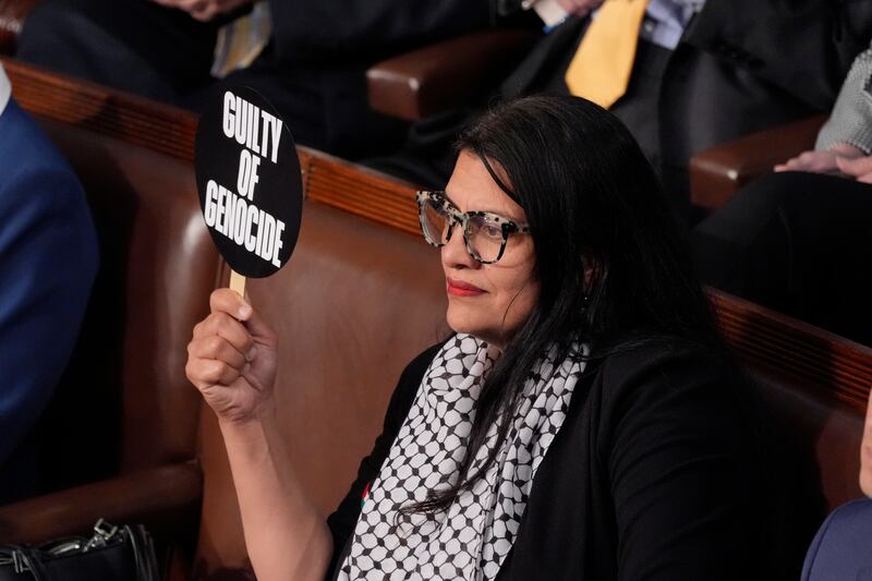 Congresswoman Rashida Tlaib holds a sign that says ‘guilty of genocide’ as Benjamin Netanyahu delivered a speech to Congress (AP Photo/J Scott Applewhite)