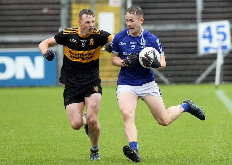 Cavan's Jonny McCabe of Arva (right) battles against Jason McLoughlin in action during this year's junior championship. (Picture: Adrian Donohoe)