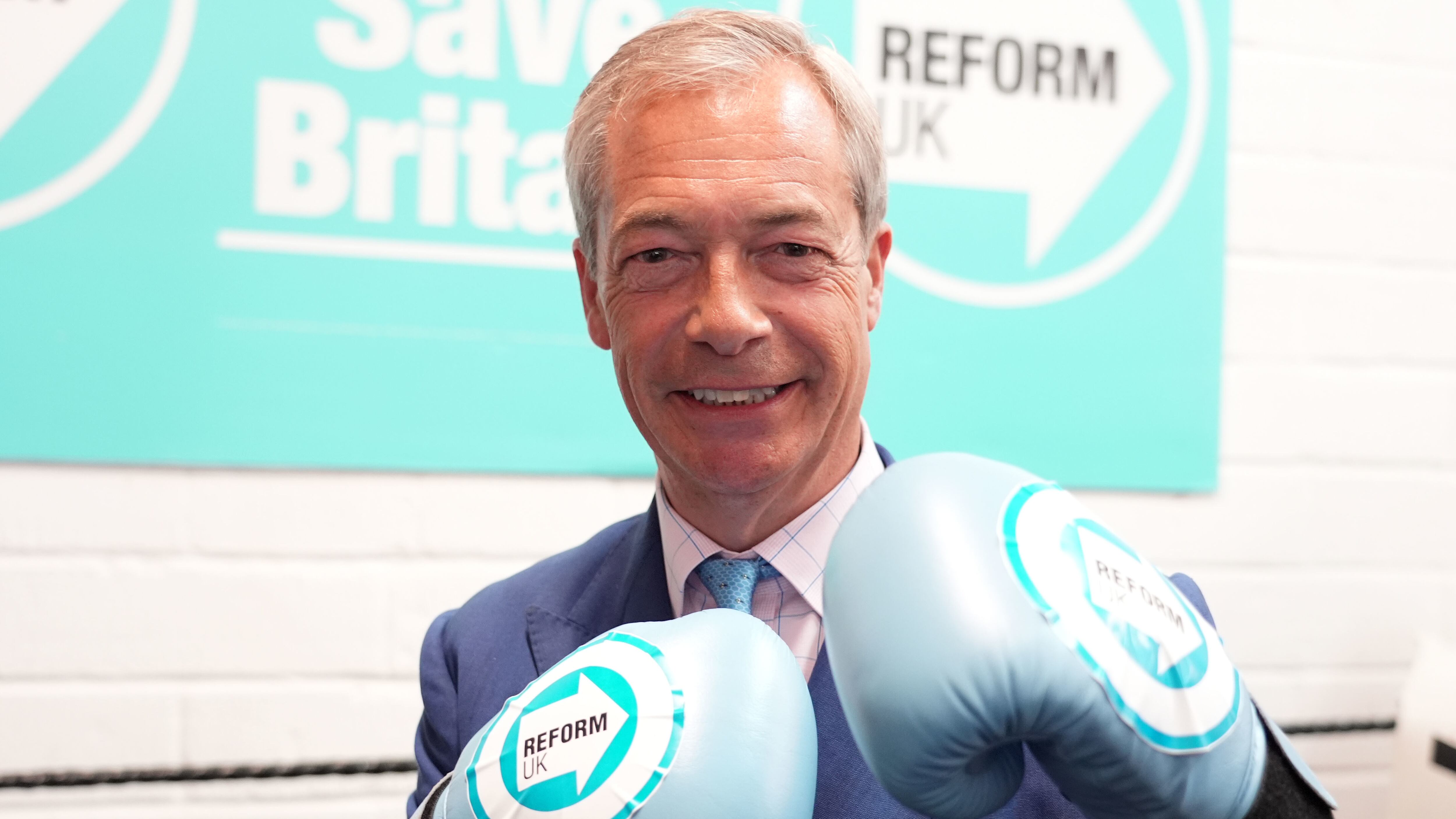 Reform UK leader Nigel Farage wearing boxing gloves at a boxing gym in Clacton
