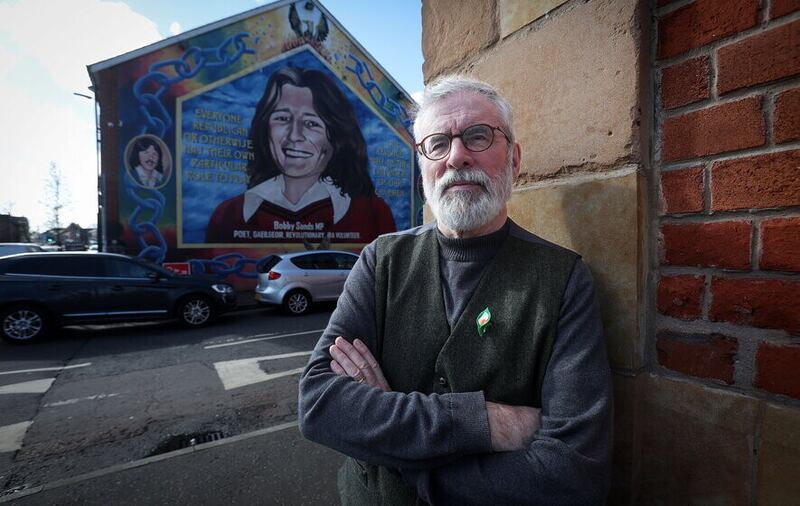 Former Sinn Féin president Gerry Adams with the Bobby Sands mural on the Falls Road in west Belfast in the background. Picture by Mal McCann