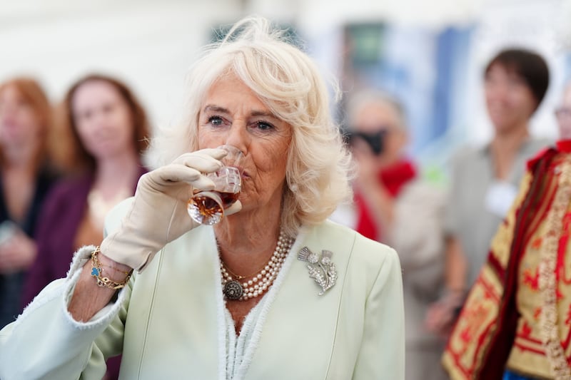 The Queen tries a glass of whisky at Edinburgh Castle