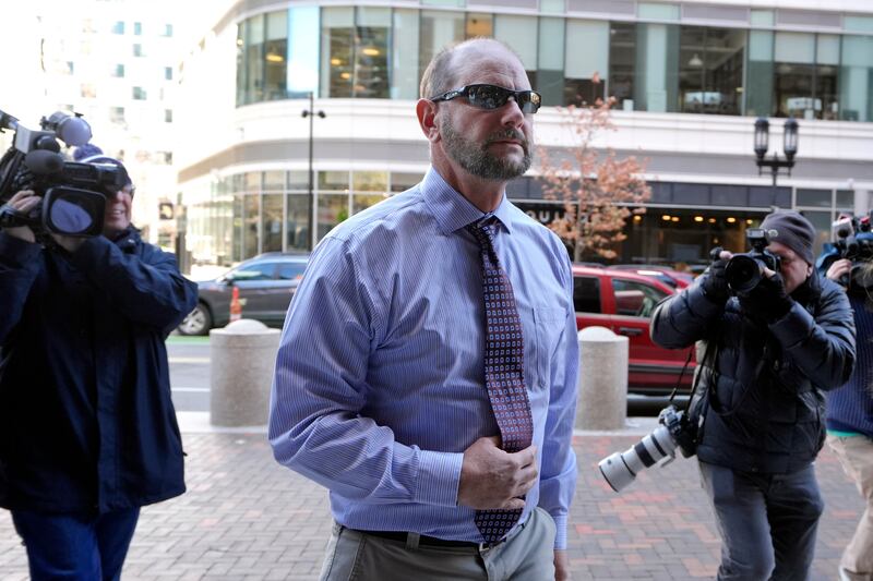 Jack Michael Teixeira, centre, father of Massachusetts Air National Guardsman Jack Teixeira. arrives at federal court for the sentencing (Steven Senne/AP)