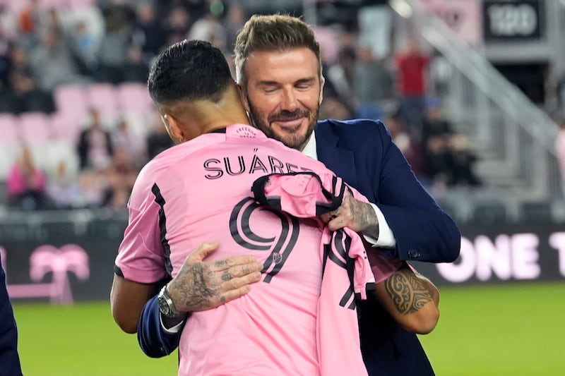 Inter Miami co-owner David Beckham hugs Luis Suarez (Lynne Sladky/AP)