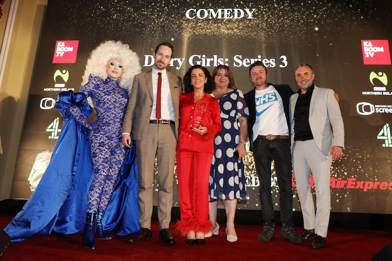 Winner of the RTS NI Scripted Comedy Award 2023 is Derry Girls by Hat Trick Productions. Pictured receiving their award from sponsor City Air Express Ian Wilson are the Hat Trick team with awards host Blu Hydrangea. Photo by Press Eye.
