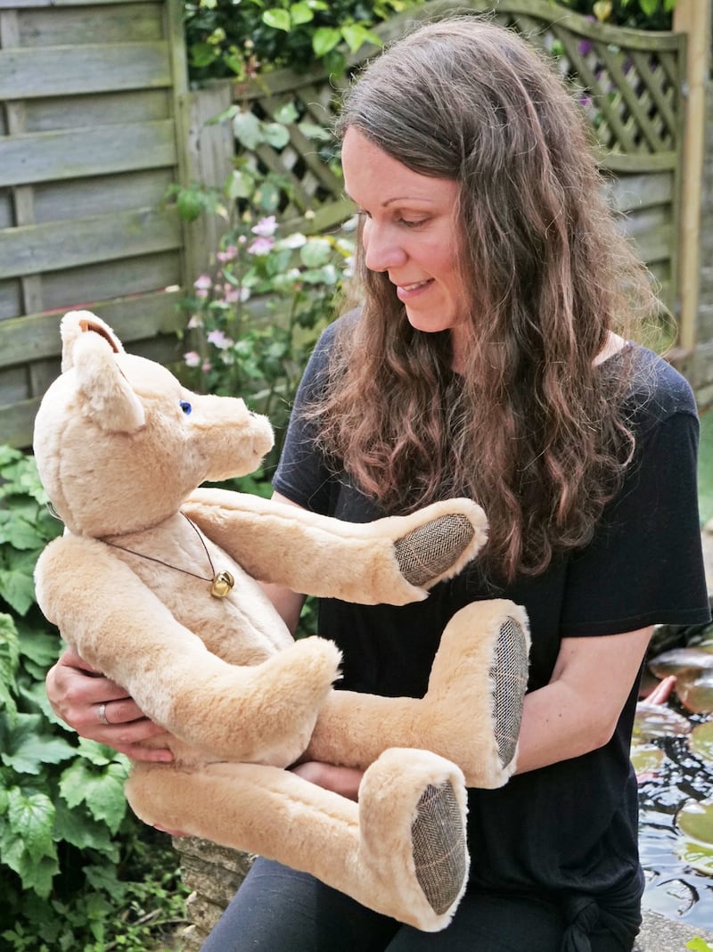 Woman holding bear 