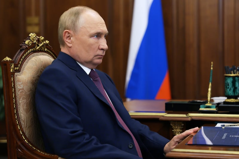 Russian President Vladimir Putin listens to Astrakhan region governor Igor Babushkin during their meeting at the Kremlin in Moscow, Russia (Kremlin Pool Photo via AP)