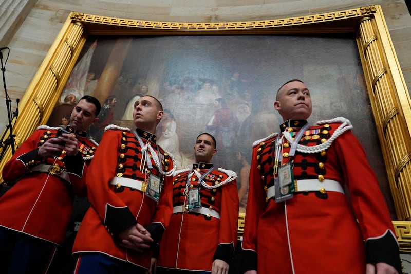 Members of the US Marine Band, The President’s Own, arrive before the 60th Presidential Inauguration in the Rotunda of the US Capitol in Washington (Julia Demaree Nikhinson, Pool/AP)