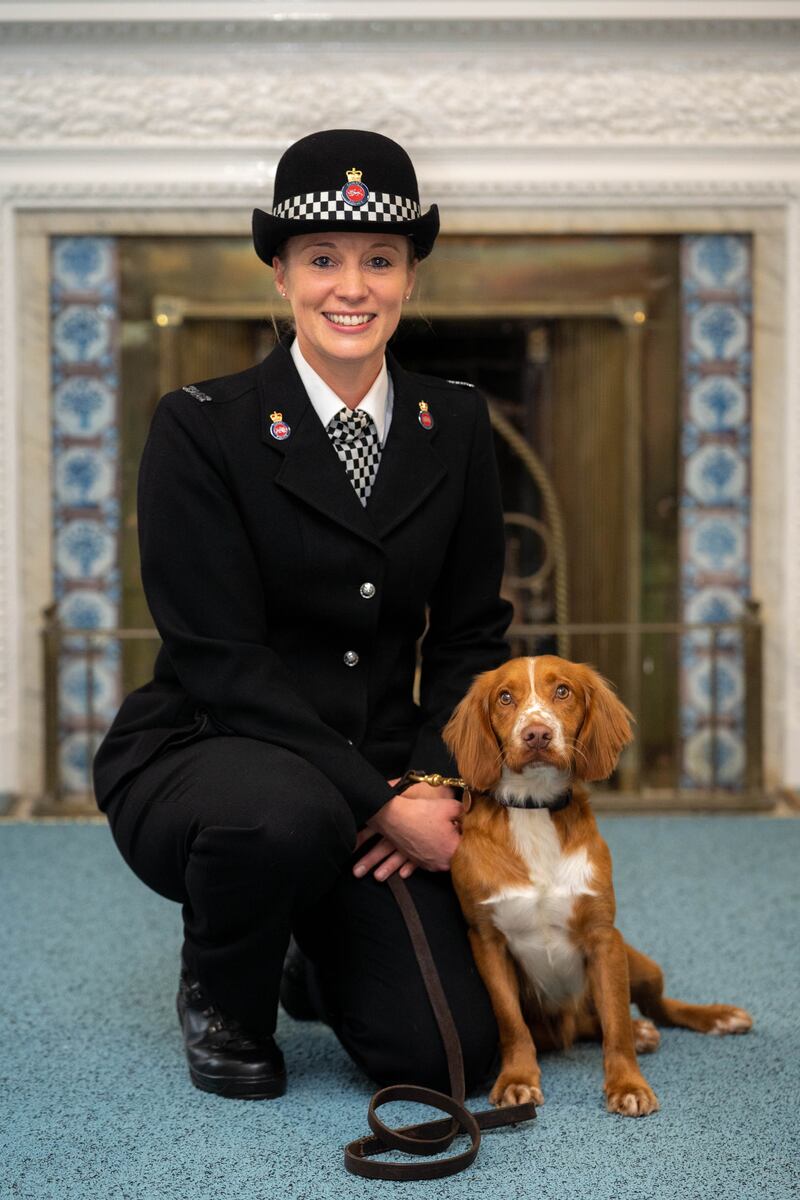 Cocker spaniel PD Chester alongside his handler PC Kim Hackett. 