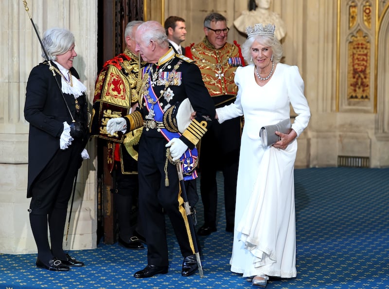 The King chats happily to Black Rod as he leaves the State Opening