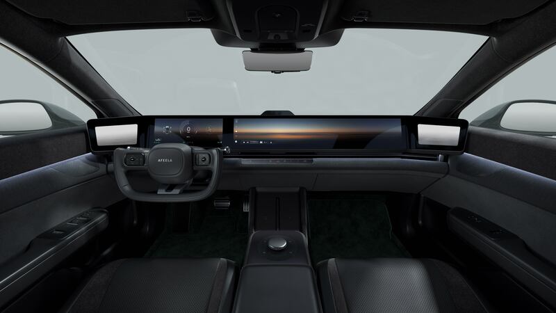 The interior features a full length screen and ‘half-yoke’ steering wheel. (Sony Honda Mobility)