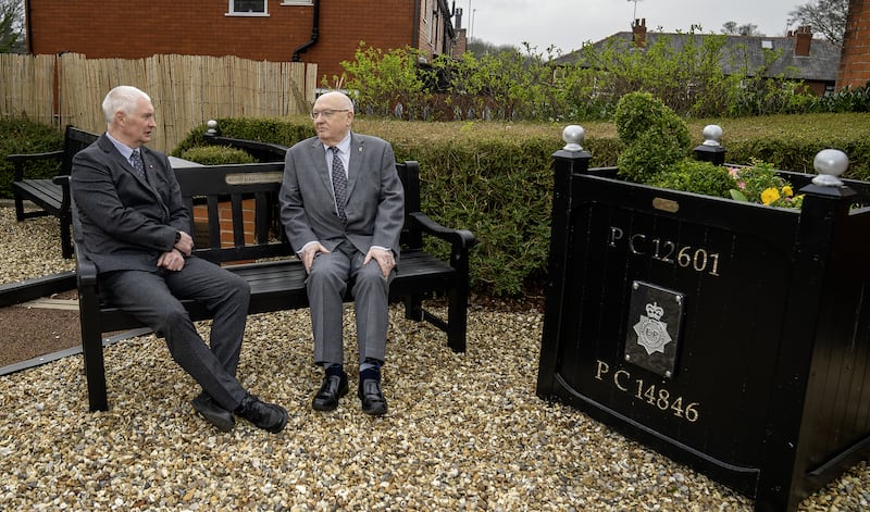 Bryn Hughes and Paul Bone, the fathers of murdered Pcs Nicola Hughes and Fiona Bone, at the Hyde police station memorial garden, in Manchester