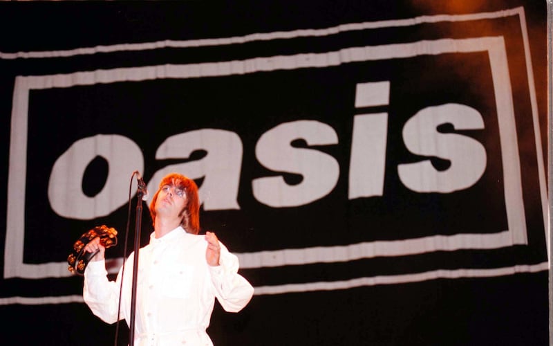 Liam Gallagher on stage with Oasis at Knebworth in 1996