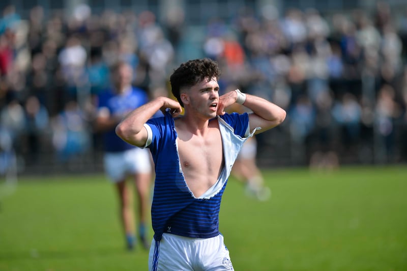 Clan Na Gael's Calum O'Neill with his jersey ripped