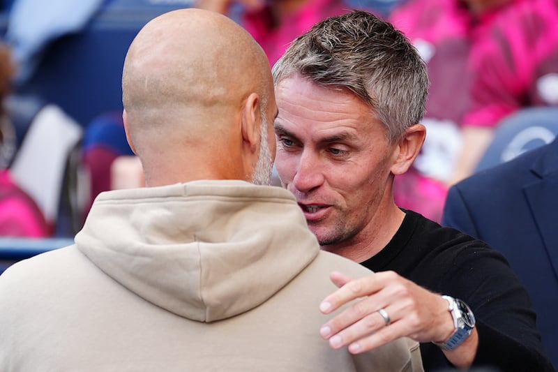 Ipswich manager Kieran McKenna (right) and City’s Pep Guardiola embrace ahead of the game