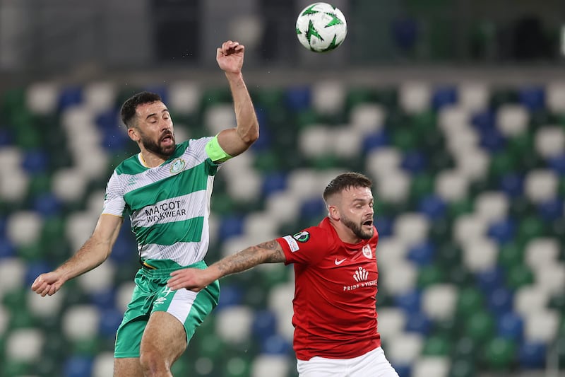 Shamrock Rovers’ Roberto Lopes (left) and Larne’s Andy Ryan battle for the ball during the Uefa Europa Conference League group stage match at Windsor Park in Belfast