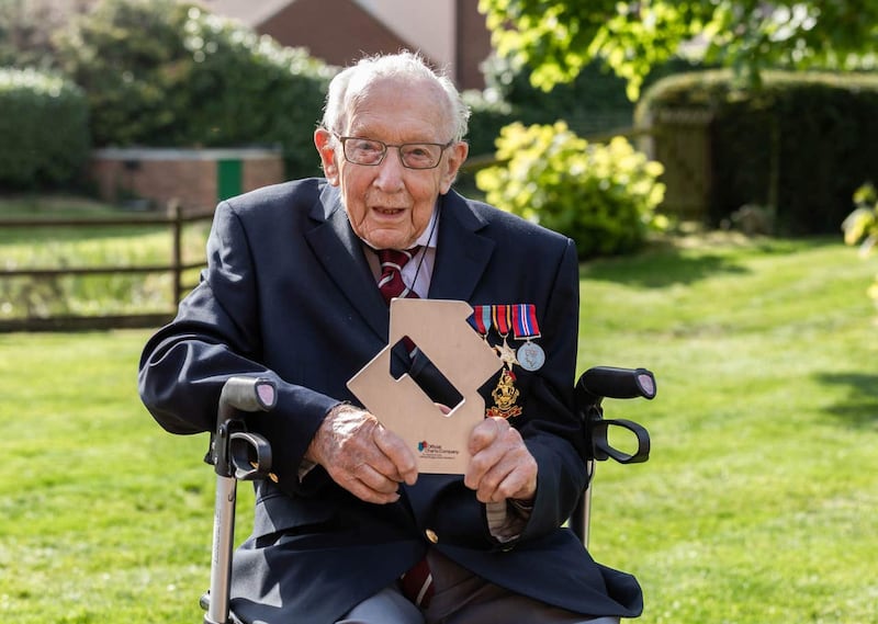 Captain Sir Tom Moore celebrating after reaching number one with his rendition of You’ll Never Walk Alone with Michael Ball and The NHS Voices Of Care Choir (Emma Sohl/Capture the Light/AP)