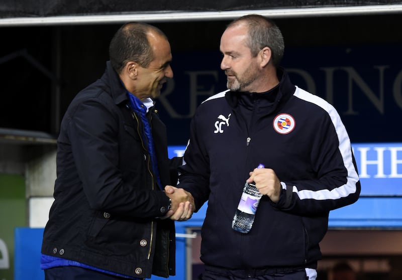 Roberto Martinez (left) believes Steve Clarke (right) will get Scotland back on track