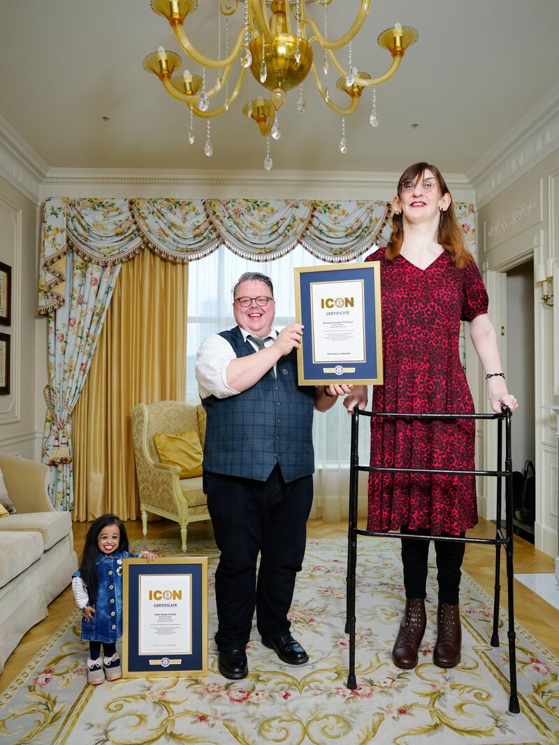 Jyoti Amge – shortest woman, Craig Glenday – Guinness World Records Editor-In-Chief, and Rumeysa Gelgi – tallest woman, meet for the first time and share afternoon tea