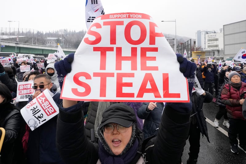 A supporter of impeached South Korean President Yoon Suk Yeol shouts slogans during a rally to oppose his impeachment near the presidential residence in Seoul (Ahn Young-joon/AP)