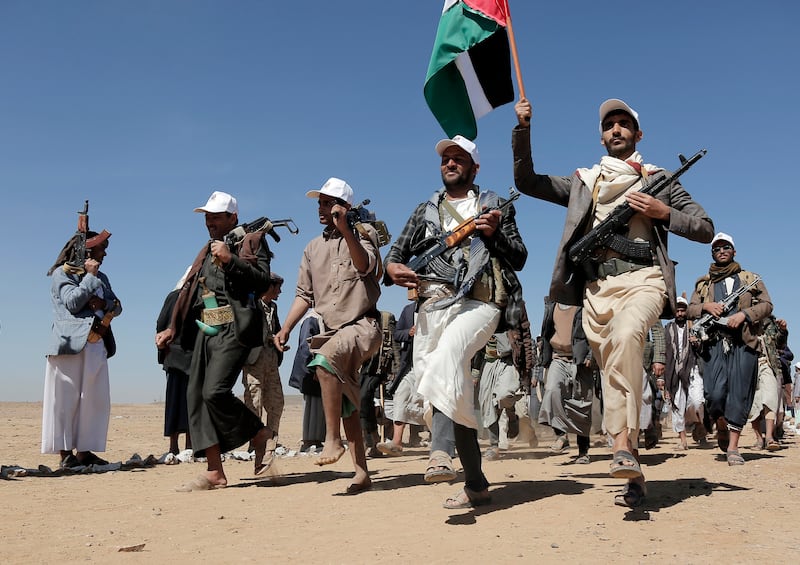 Houthi fighters march during a rally of support for Palestinians in the Gaza Strip (AP)