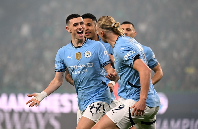 Phil Foden celebrates scoring the opener