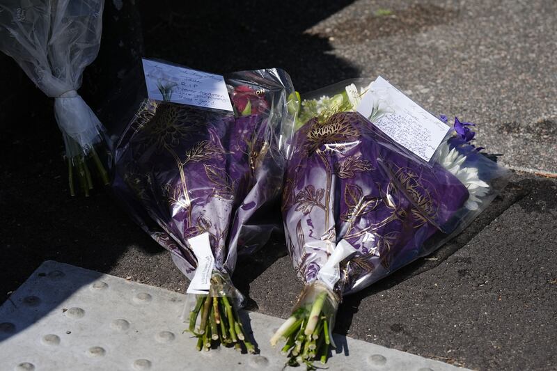 Floral tributes were left on Overbury Street, near the scene in Rushmore Road, Clapton