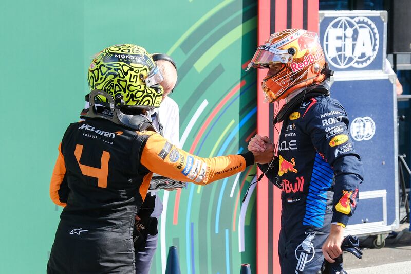 Max Verstappen, right, congratulates Norris on his victory (Patrick Post/AP)