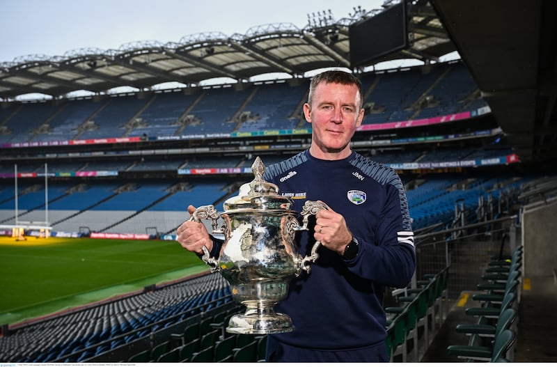 Laois manager Justin McNulty holds the Tailteann Cup during a media day at Croke Park.