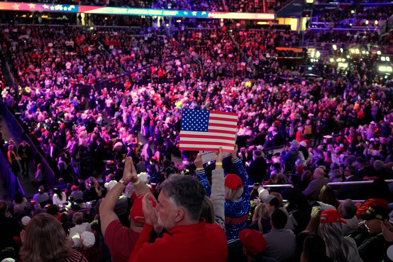 Attendees cheer before President-elect Donald Trump arrives at a rally ahead of the 60th presidential inauguration in Washington (Alex Brandon/AP)