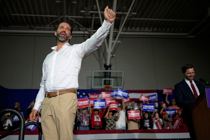 Donald Trump Jr with Republican vice presidential nominee JD Vance at a campaign rally on Saturday (John Locher/AP)