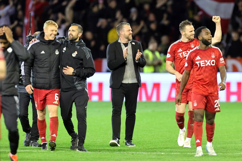 Jimmy Thelin, centre, and his players celebrate Wednesday’s victory