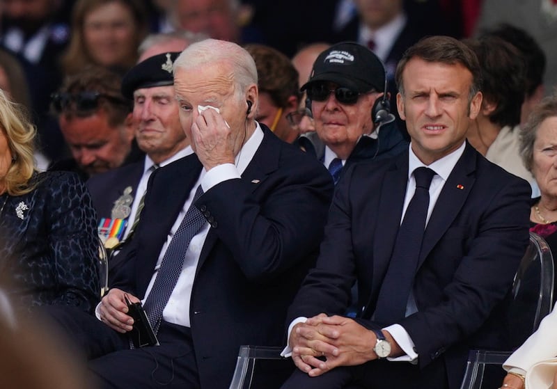 US President Joe Biden wipes his eye during the official international ceremony to mark the 80th anniversary of D-Day at Omaha Beach in Saint-Laurent-sur-Mer, Normandy, France