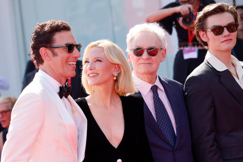 Sacha Baron Cohen, from left, Cate Blanchett, Kevin Kline and Louis Partridge pose for photographers in Venice. (Joel C Ryan/AP)