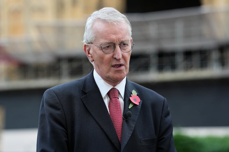 Northern Ireland Secretary Hilary Benn speaks to the media on College Green in Westminster, London