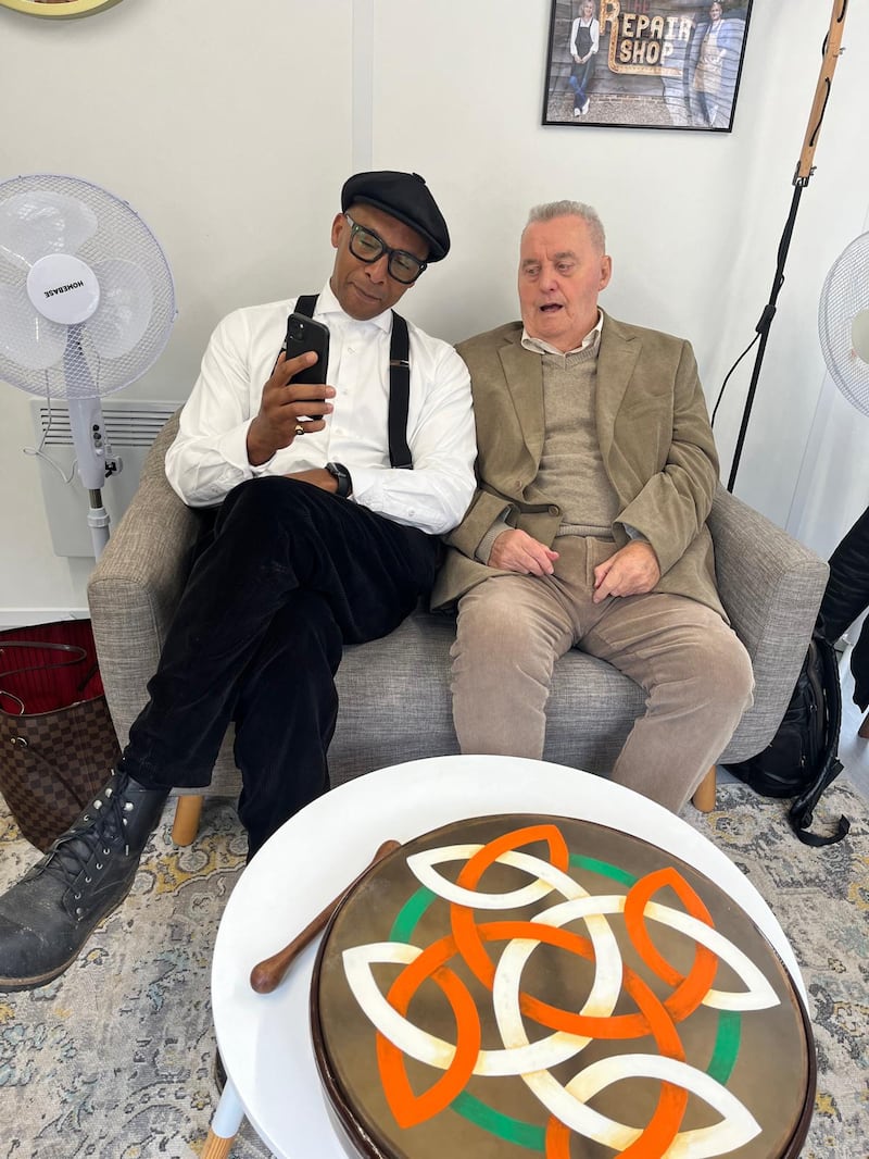 Seamus' dad, Jackie, enjoying the craic with The Repair Shop presenter, Jay Blades, following the reveal of the repaired bodhrán.