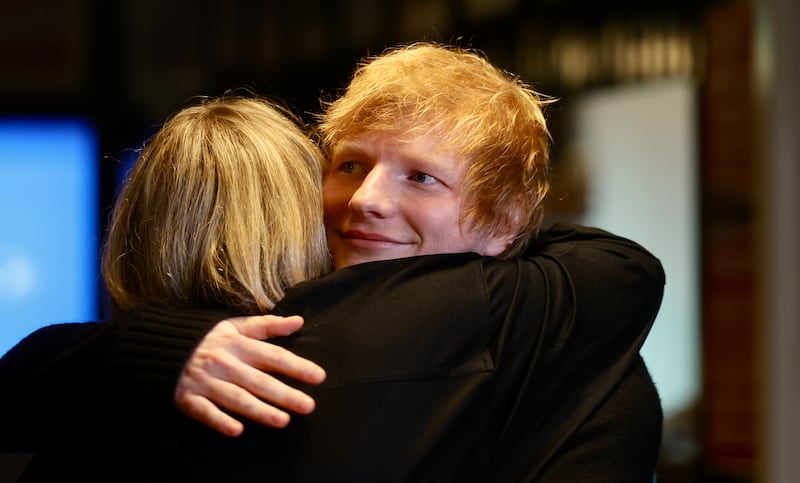 Ed Sheeran and Gary Lightbody  with Charlotte Dryden  who speak to the media at the Oh Yea Centre during a visit to Belfast.
PICTURE COLM LENAGHAN