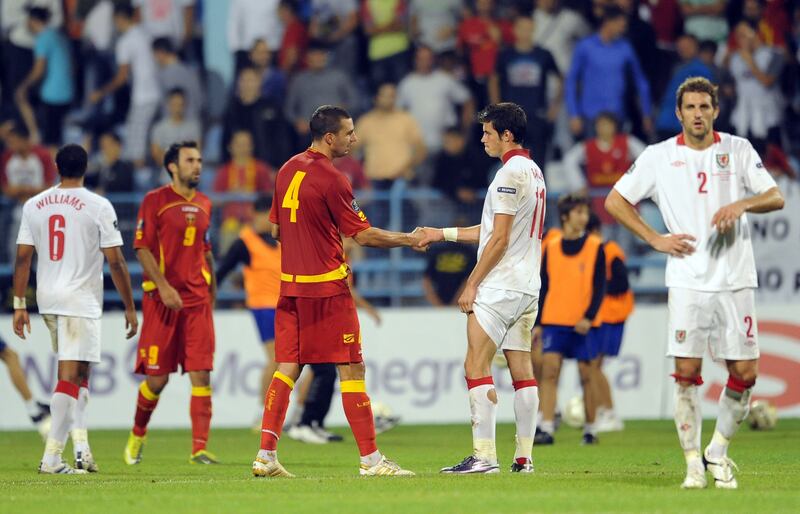 Gareth Bale shakes hands with Montenegro’s Milan Jovanovic after Wales’ 1-0 European Championship qualifying defeat in Podgorica in September 2010