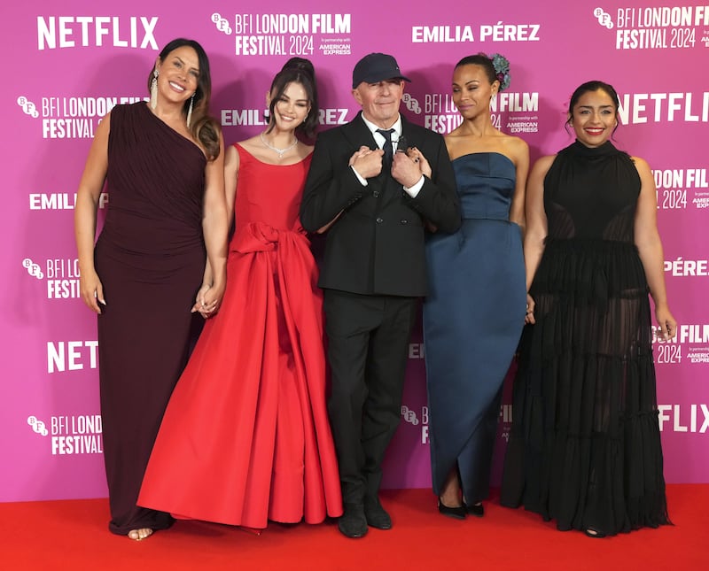 (left to right) Karla Sofia Gascon, Selena Gomez, Jacques Audiard, Zoe Saldana and Adriana Paz attend the BFI London Film Festival gala screening of Emilia Perez, at the Royal Festival Hall, Southbank Centre in London