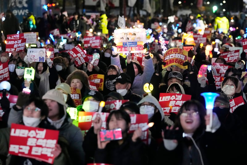 Participants stage a rally to demand South Korean President Yoon Suk Yeol’s impeachment outside the National Assembly in Seoul (AP/Ahnn Young-joon)